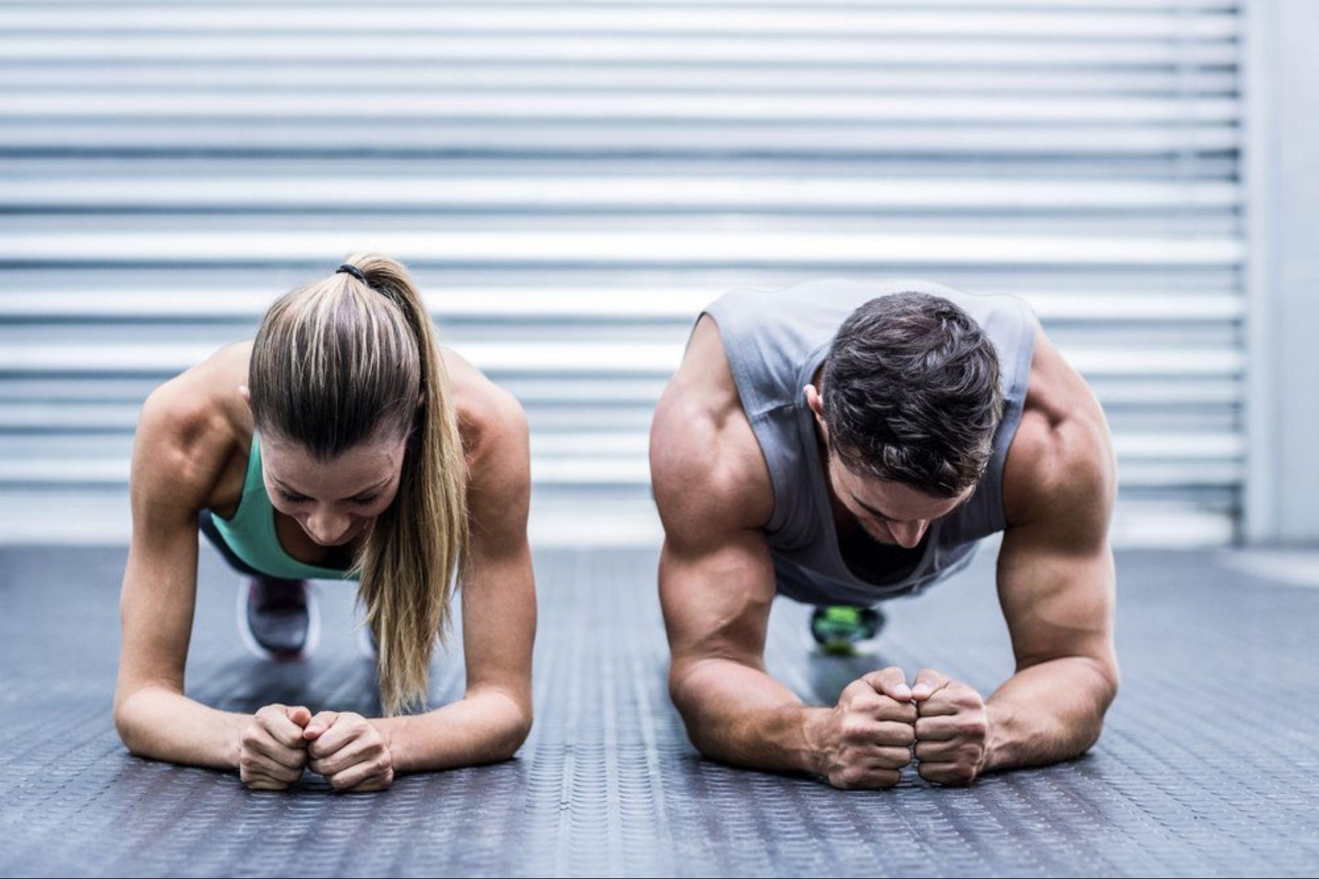 Two people doing planks